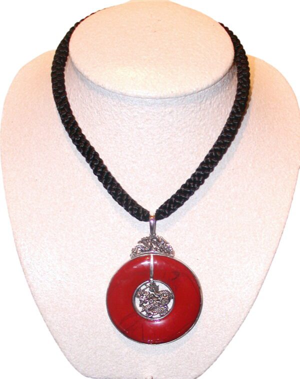 A red and black necklace is shown on display.