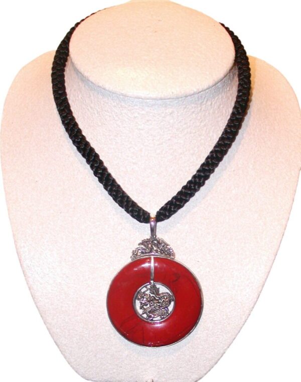 A red and black necklace is shown on display.
