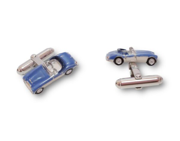 A pair of cufflinks with a blue car and a silver car.