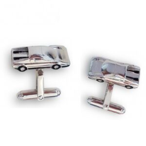 A pair of cufflinks with a car on them.