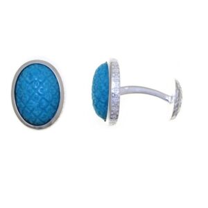 A pair of Carved Turquoise Tile cufflinks featuring blue textured centers surrounded by silver frames, displayed on a white background.