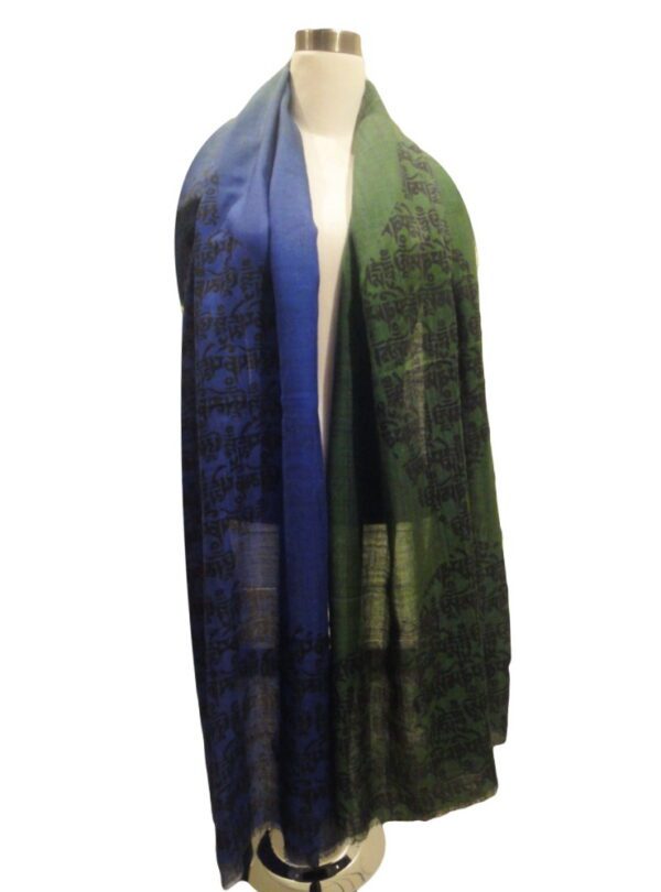 A long scarf with a blue and green design.