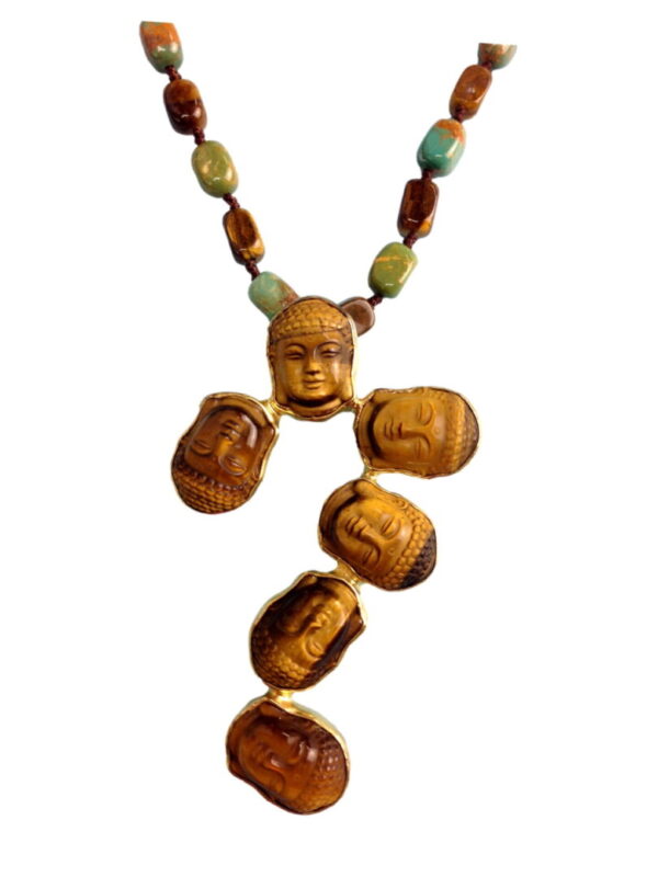 A necklace with faces of buddha and other people.