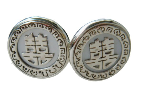 A pair of cufflinks with the chinese symbol for double happiness.
