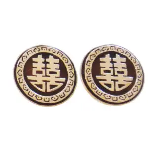 A pair of earrings with the symbol for two asian letters.