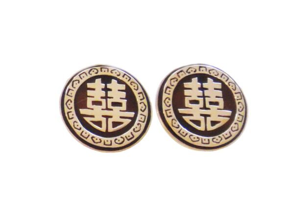 A pair of earrings with the symbol for two asian letters.