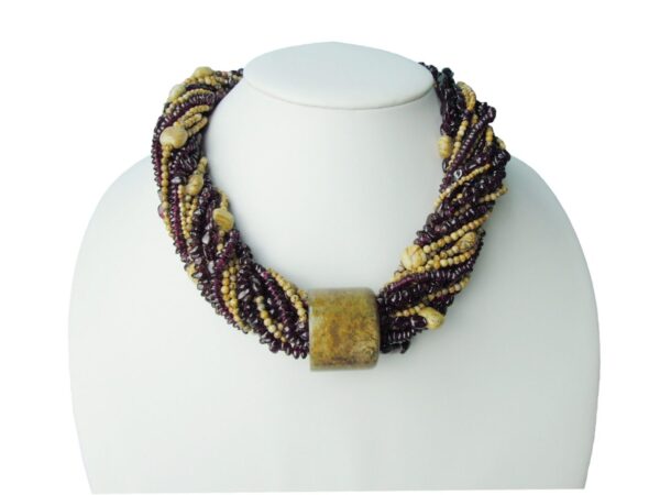A necklace with purple and gold beads on it.