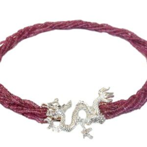 A red necklace with silver dragon clasp.