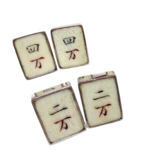 A set of four tiles with the word " mahjong " written in red ink.