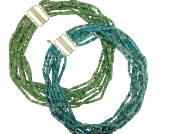 Two necklaces of green and blue glass beads.