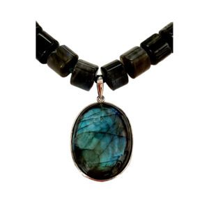 A necklace with a large blue stone on it