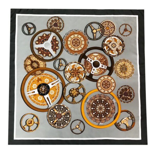 A large square scarf with various circular designs on it.