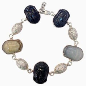 A silver bracelet with different colored beads and faces.