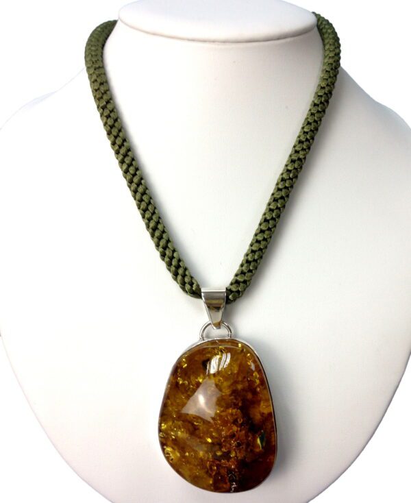 Hand Knotted 6mm cord necklace with a large amber pendant displayed on a white mannequin bust.