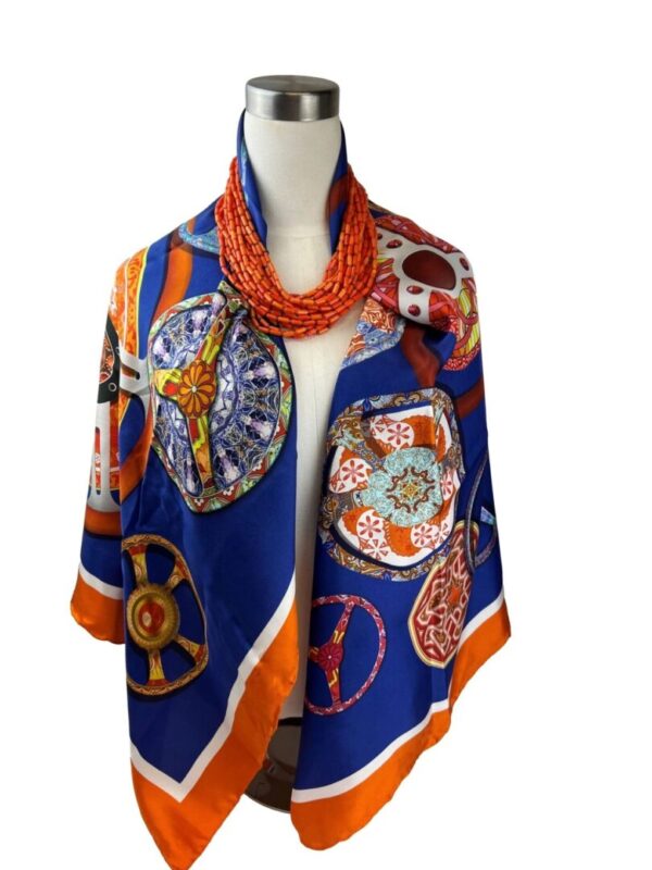 bright scarf with coral necklace