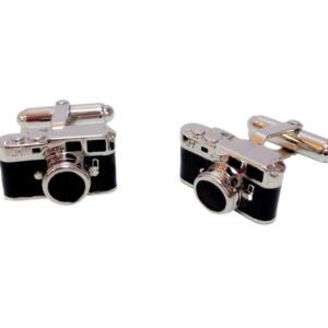 A pair of cufflinks with a camera on them.