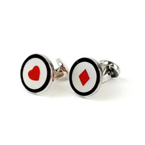 A pair of cufflinks with the image of a heart and diamond.
