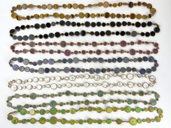 A bunch of different colored beads are lined up