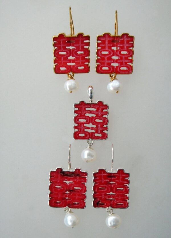 Three pairs of Coral Double Happiness Earring with Dangle displayed vertically against a light background.