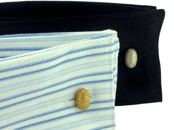 A close up of two shirts with buttons on them