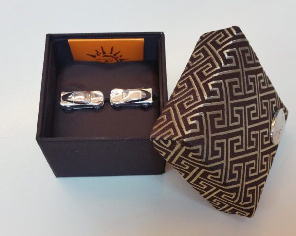 A tie and cufflinks in a box