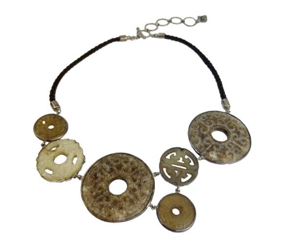 A necklace with several circular discs on it.