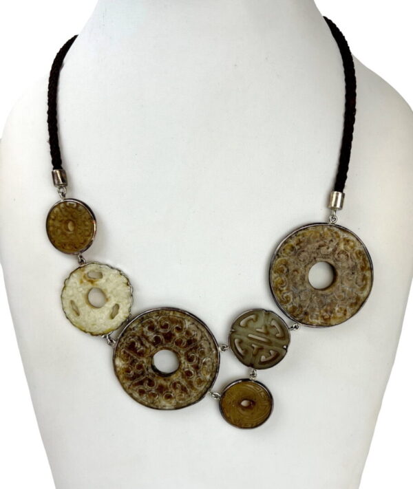 A necklace with different colored discs on it