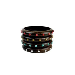 A stack of four wooden bangles with colored stones.