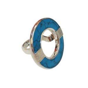 Fancy Stone Donut Wrapped Ring featuring a large, blue enamel circle with a cracked pattern, centered with a silver band, against a white background.