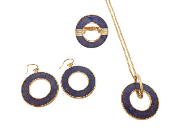 A set of jewelry that includes earrings, necklace and ring.