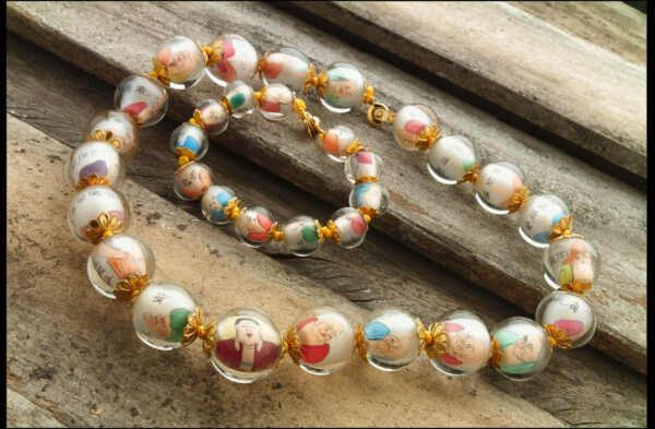 A close up of a necklace on a wooden surface