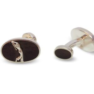 A pair of cufflinks with a black background and silver design.