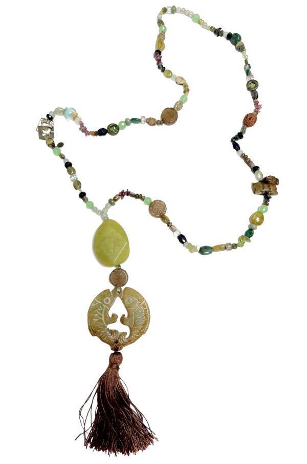 A long necklace with various beads and stones.