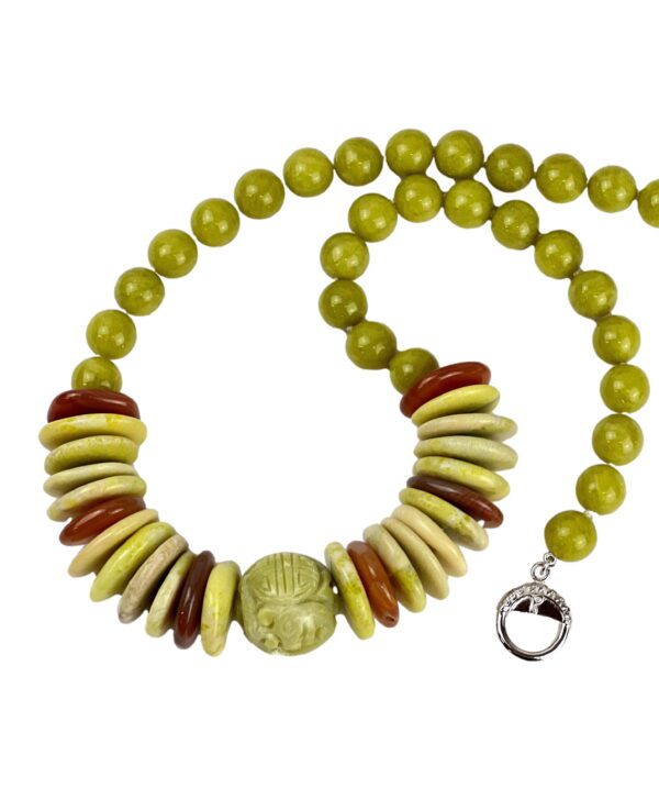 A necklace with yellow beads and red accents.