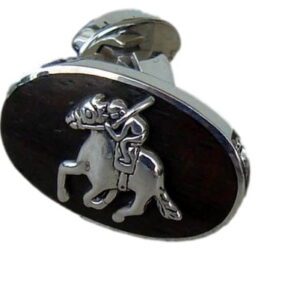A silver and black cufflinks with a horse on it