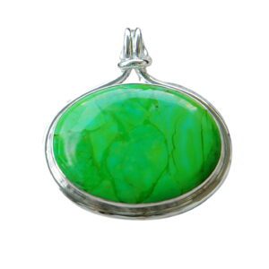 A green stone is in the middle of a silver frame.