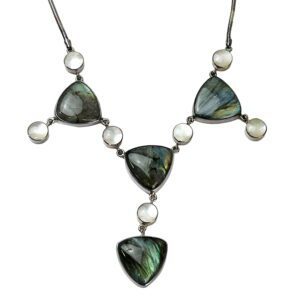 A necklace with green and white stones on it.