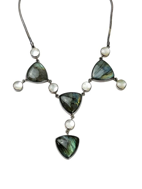 A necklace with green and white stones on it.