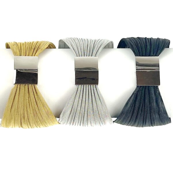 A group of three brushes in different colors.