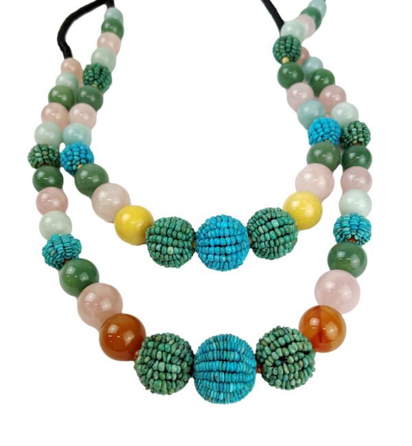 A necklace with beads and stones on it