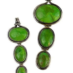 A pair of green glass pendants with silver frames.