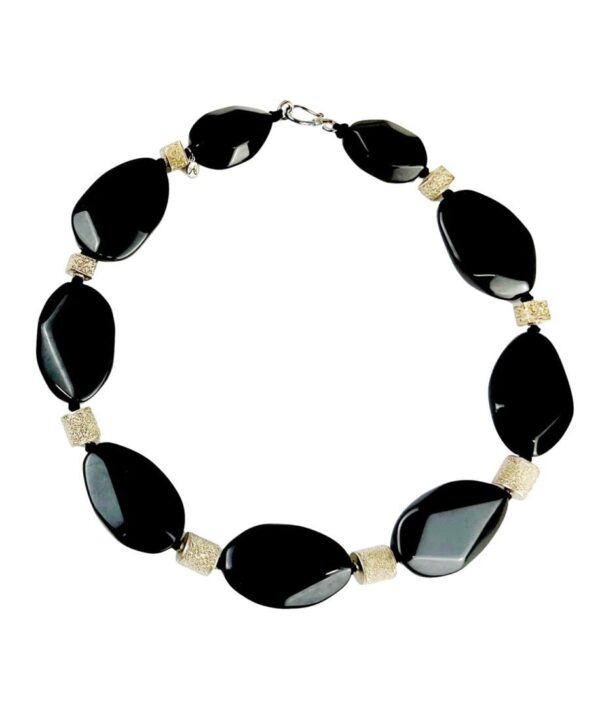 A black and white necklace is shown.
