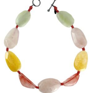 A necklace of various colored stones and red cord.