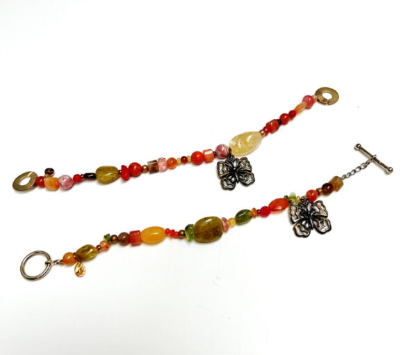 A bracelet and necklace with different colored beads.