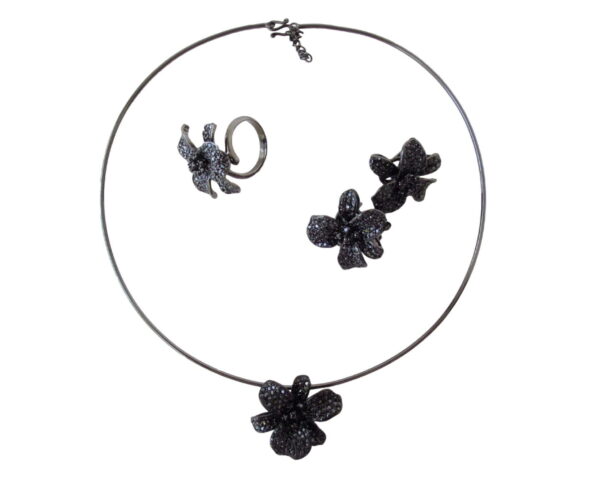 A necklace, ring and earring set with black flowers.
