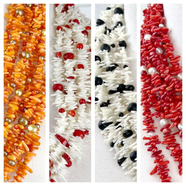 A bunch of different colored beads are on the table