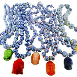 A group of colorful beads with buddha heads on them.