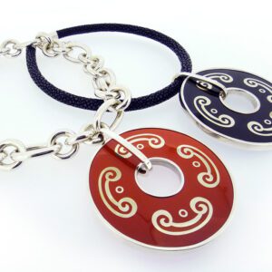 A pair of necklaces with red and blue circles.