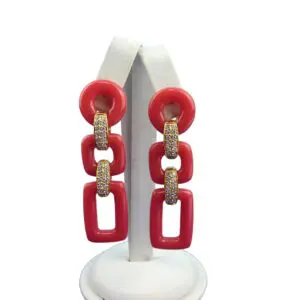 Geometric 3 Tier Resin Earrings displayed on a white stand against a white background.