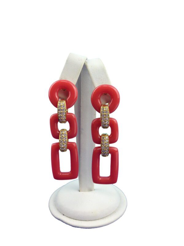 Geometric 3 Tier Resin Earrings displayed on a white stand against a white background.